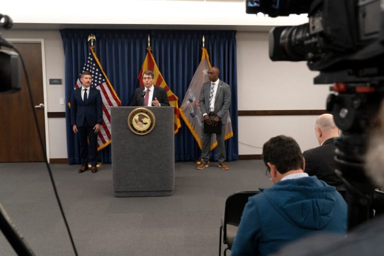 Federal officials say 20 have been charged for threatening election workers